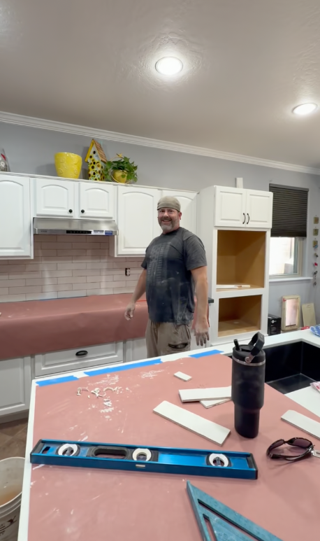 Travis smiling in the kitchen job site